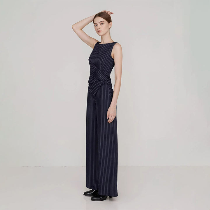 Striped sleeveless asymmetric top and straight-leg trousers set