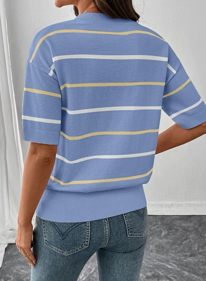 A woman shown from the back wearing a short-sleeve knit top with horizontal light blue, white, and pale yellow stripes, paired with blue jeans in an indoor setting.