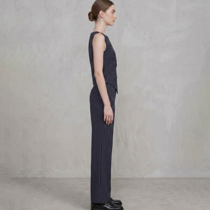 Striped sleeveless asymmetric top and straight-leg trousers set