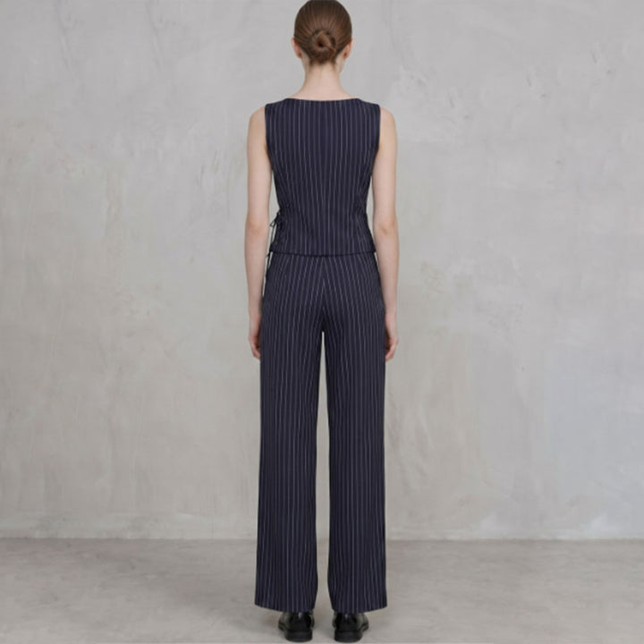 Striped sleeveless asymmetric top and straight-leg trousers set