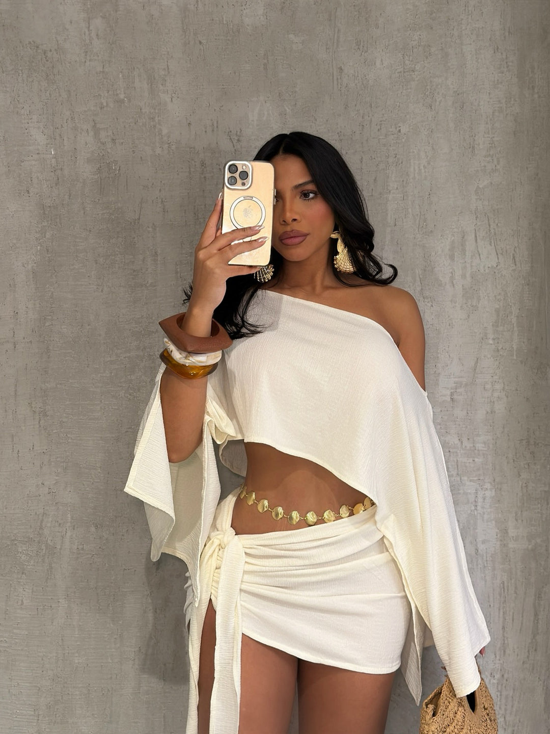 One-shoulder top and hip-hugging mini skirt set