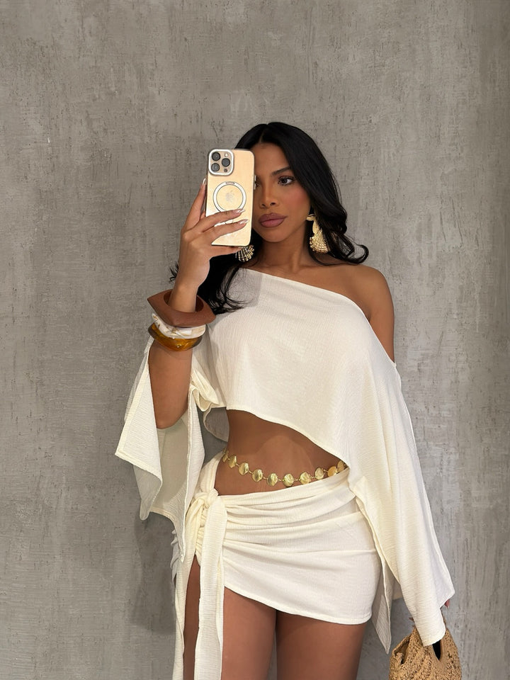 One-shoulder top and hip-hugging mini skirt set