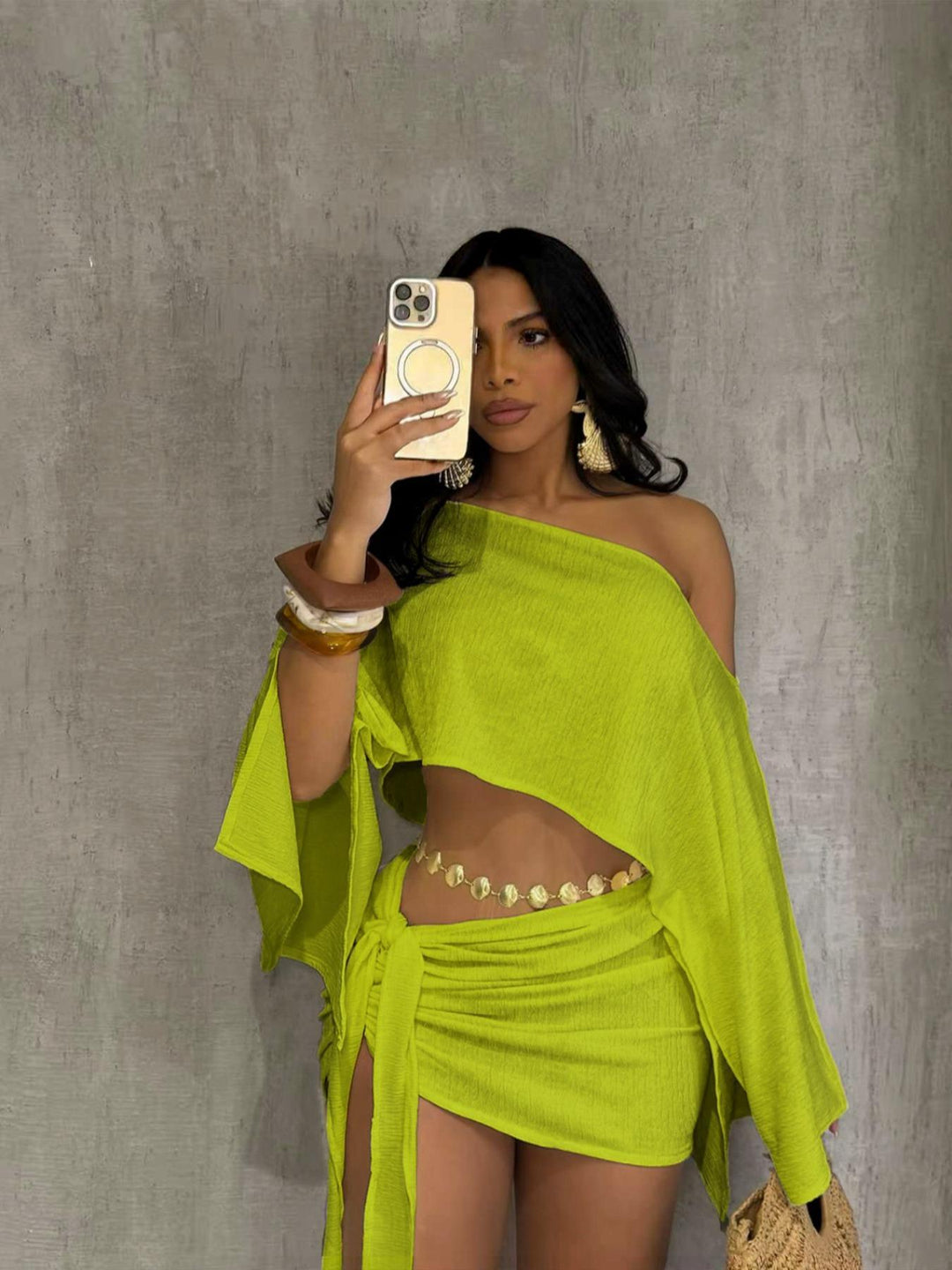 One-shoulder top and hip-hugging mini skirt set