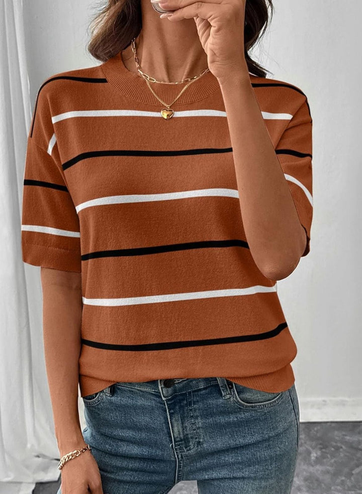 Person wearing a brown striped shirt and blue jeans against a white background